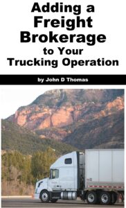 Truck in mountainous landscape with book title.